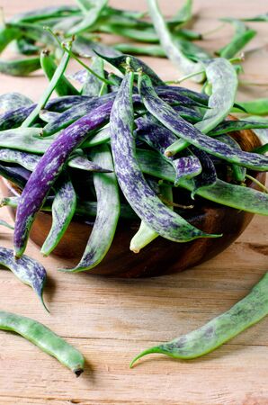French bean in a wooden bowl