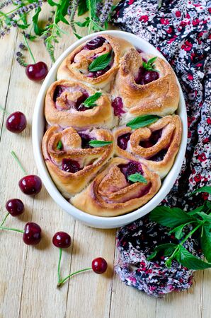 Brioche rolls with cherry and mintの写真素材