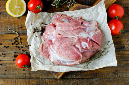 Raw turkey thigh fillets on a wooden tableの写真素材