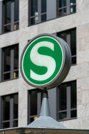 Nordbahnhof, Berlin, Germany - july 07, 2019:  the typical green and white round S sign for Berlin public railway transport on the roof of a stationのeditorial素材