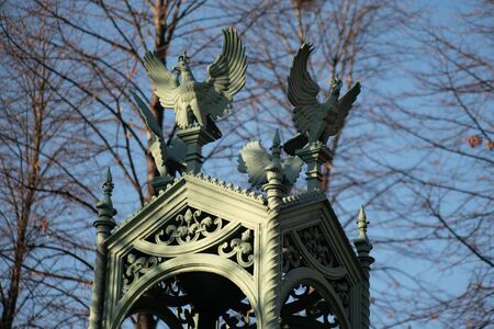 Eagle sculptures on top of  the roof of a mausoleum at Invalidenfriedhof in Berlin Germanyの写真素材