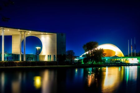 Berlin, Germany - november 17, 2018: the illuminated chancellors office and the house of cultures...