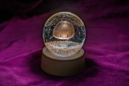 Close up of an Illuminated paperweight with velvet backgroundの写真素材