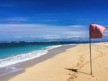 White beach in the daytime with perfect blue sea and clear blue sky. Idyllic seaside landscape for...