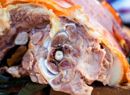 Juicy pork meat on bone. Grilled pig slice ready for serving. Rich protein nutrition. Asian traditional food in outdoor eatery. Cut meat and bone structure. Tasty baked pork closeup for recipe bookの写真素材