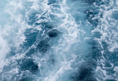 Sea water ship trail with foamy wave. Tropical islands ferry travel. Cruiseliner seawater trail. Deep ocean top view. Big ship pitching image. White swirl wave in sea. Marine cruise travel backgroundの写真素材