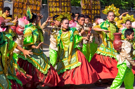 Dumaguete, Philippines - 16 September, 2017: Sandurot Festival street dancers. Carnival with dancing in colorful costumes. Philippines traditional costumes and dance parade. Girls in spanish dressesのeditorial素材