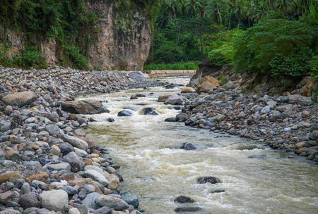 Mountain river with stones. Tropical landscape. Fresh river in stone riverbed. Tropical nature in rain season. Jungle bush view. Thailand rafting. Summer travel adventure. Ecotourism and trekkingの写真素材