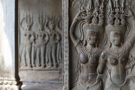 Stone bas-relief with human figure in Angkor Wat temple, Siem Reap, Cambodia.の写真素材