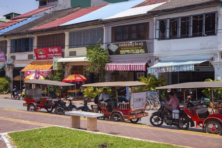 Kampot, Cambodia - 12 April 2018: town view with french colonial buildings and khmer people daily lifestyle. Cambodian travel photo. Tourist place sightseeing. Khmer daily routine. Urban landscapeのeditorial素材
