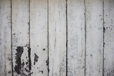 White painted wooden board photo texture. Natural wood background. Distressed rough lumber board. Natural timber surface. Wooden table template. Lumber plank floor. Weathered painted timber top viewの写真素材