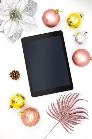 Pink and gold Christmas ornament on white. Winter holiday vertical photo background. New Year Christmas social media greeting cover. Tablet and fir tree bauble mockup. Xmas stories templateの写真素材