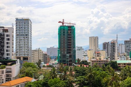 Nha Trang, Vietnam - 24 Jul 2019: Hotel buildings and construction site, city landscape. New hotel or apartment building. Travel industry development. Real estate in modern asian city. Tall skycrapersのeditorial素材