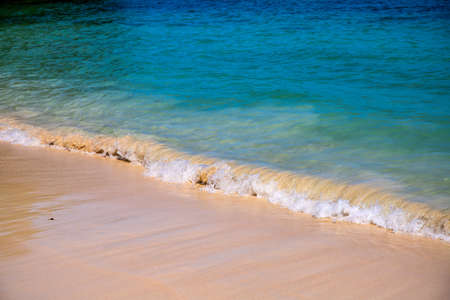 Blue sea water and white beach on sunny day. Tropical island paradise photo. Clear seawater tide on smooth sand. Exotic place for summer vacation. South Asia travel. Tourist resort relaxing viewの写真素材