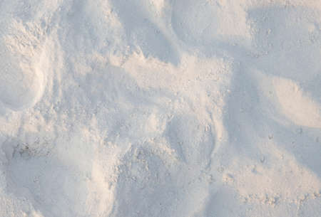 White sand on the beach, abstract summer background. Sandy seashore top view photo. Tropical beach...