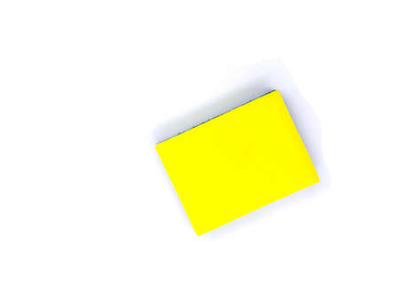 New yellow sponge for dish or car washing. Cleaning sponge top view photo on white background. Janitor or maid tool. Simple kitchen cleaning rub. Housekeeping chores banner template with text placeの写真素材