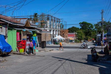 Dumaguete, the Philippines - 07 Apr 2020: empty street of philippine village during coronavirus quarantine. Modern filipino lifestyle. Stores and stall closed during pandemic community quarantine.のeditorial素材