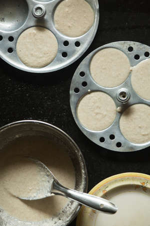 Rice Batter on Idli Maker. Top view of south Indian Dish.の写真素材