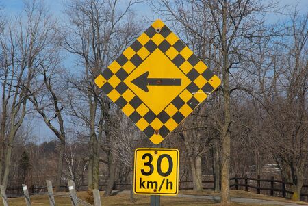 Road Sign Warning of a Curve Ahead