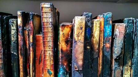 A lot of burnt books on the shelf, colorfullの写真素材
