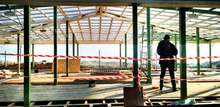 wooden terrace renovation, tools, mass, one worker, wideの写真素材