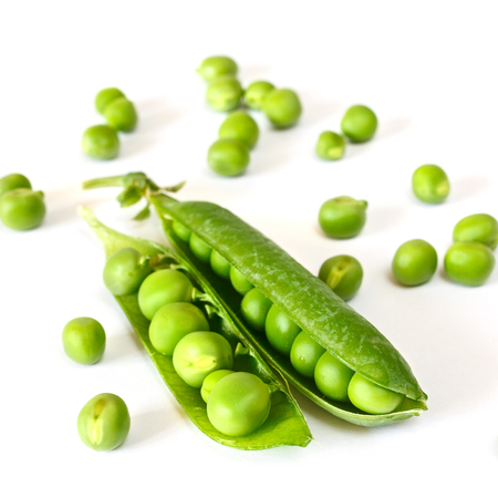 two pea pods in the center of the frame. Isolated. Horizontal image. Handful peasの写真素材