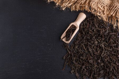 dry tea leaves on black background. Top view.の写真素材