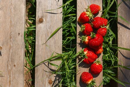 fresh strawberries on a wooden tableの写真素材