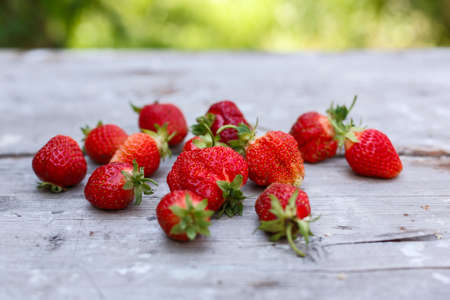 fresh strawberries on a wooden tableの写真素材