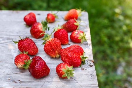 fresh strawberries on a wooden tableの写真素材