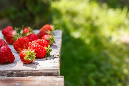 fresh strawberries on a wooden tableの写真素材