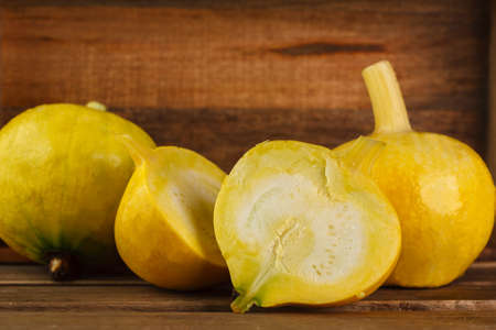 yellow pumpkins on wooden backgroundの写真素材