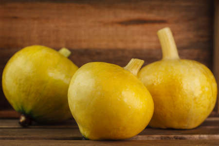 yellow pumpkins on wooden backgroundの写真素材