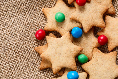Christmas or new year gingerbread cookies with colour candies