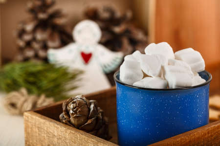 Christmas drink. Marshmallows in blue mugの写真素材