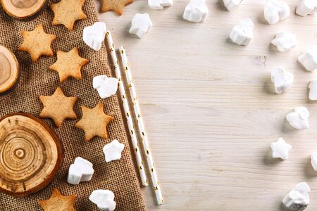 christmas decoration. ginger cookies and marshmallow on a wooden tableの写真素材