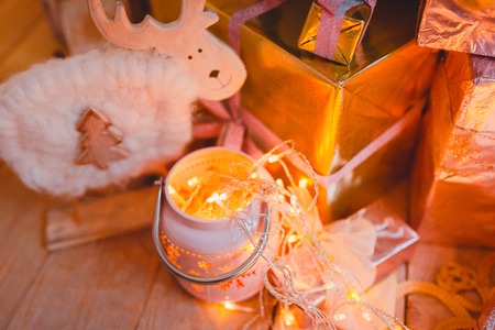 gifts pink under the Christmas tree. On a background garlandsの写真素材