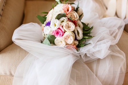 bridal bouquet on a chairの写真素材