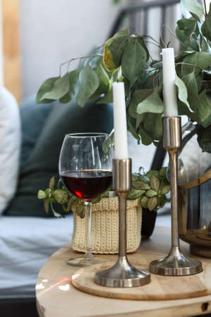 morning. Bedside table. Home decor. Wine glass Clock closeupの写真素材