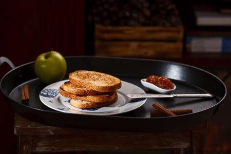 toasts with apple jam on black metallic trayの写真素材