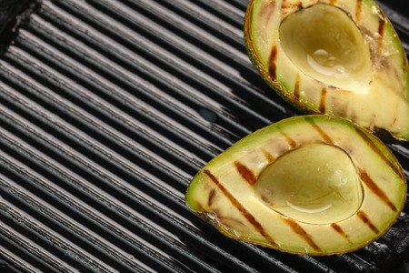sliced fresh avocado on the grill. Health food. Barbeque avocadoの写真素材
