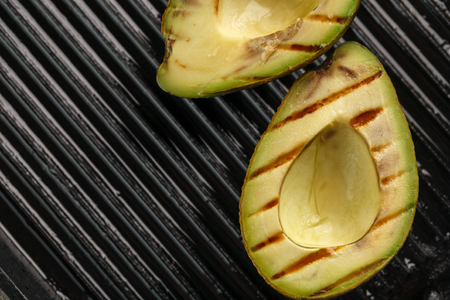 sliced fresh avocado on the grill. Health food. Barbeque avocadoの写真素材