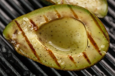 sliced fresh avocado on the grill. Health food. Barbeque avocadoの写真素材