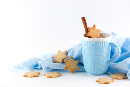 blue mug and ginger cookies on white background. Christmas compositionの写真素材