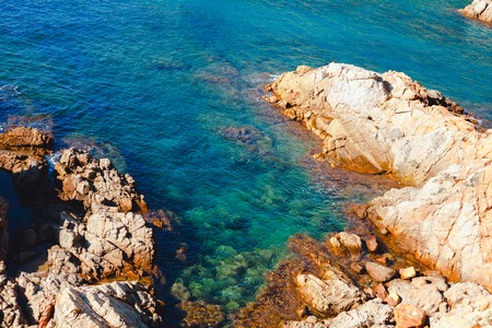 rocks in the Mediterranean sea with turquoise water