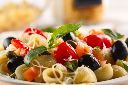 traditional Italian pasta Pipe Rigate with tomatoes, olives.の写真素材