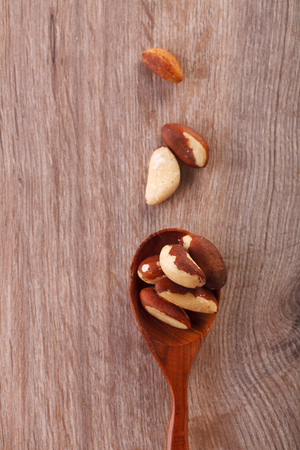 Tasty brasil nuts on rustic wooden background. Closeup. Top view. Flatlayの写真素材