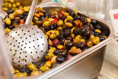 sale of marinated olives on the marketの写真素材