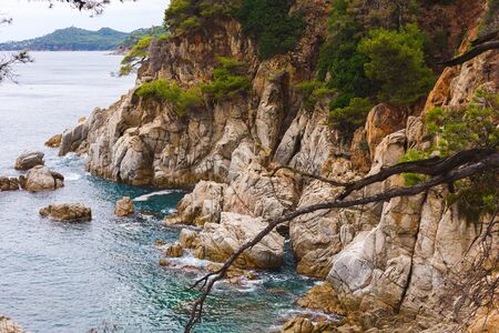 view of the rocky coast of the Mediterranean sea. Spain. Closeup