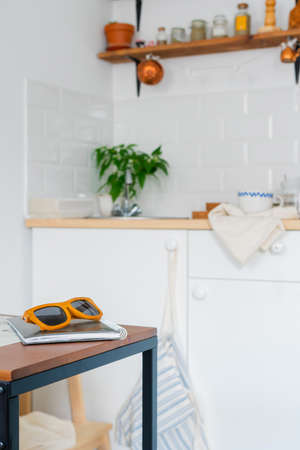 white kitchen interior. Scandinavian interior design in light colors with plants and accessories. Sunny dayの写真素材